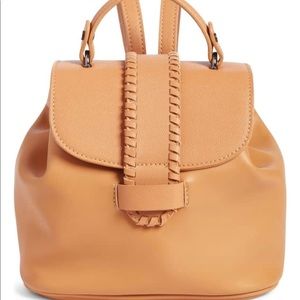 Whip stitch faux leather backpack